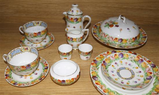 A Royal Doulton thirteen piece breakfast set, decorated with tulips